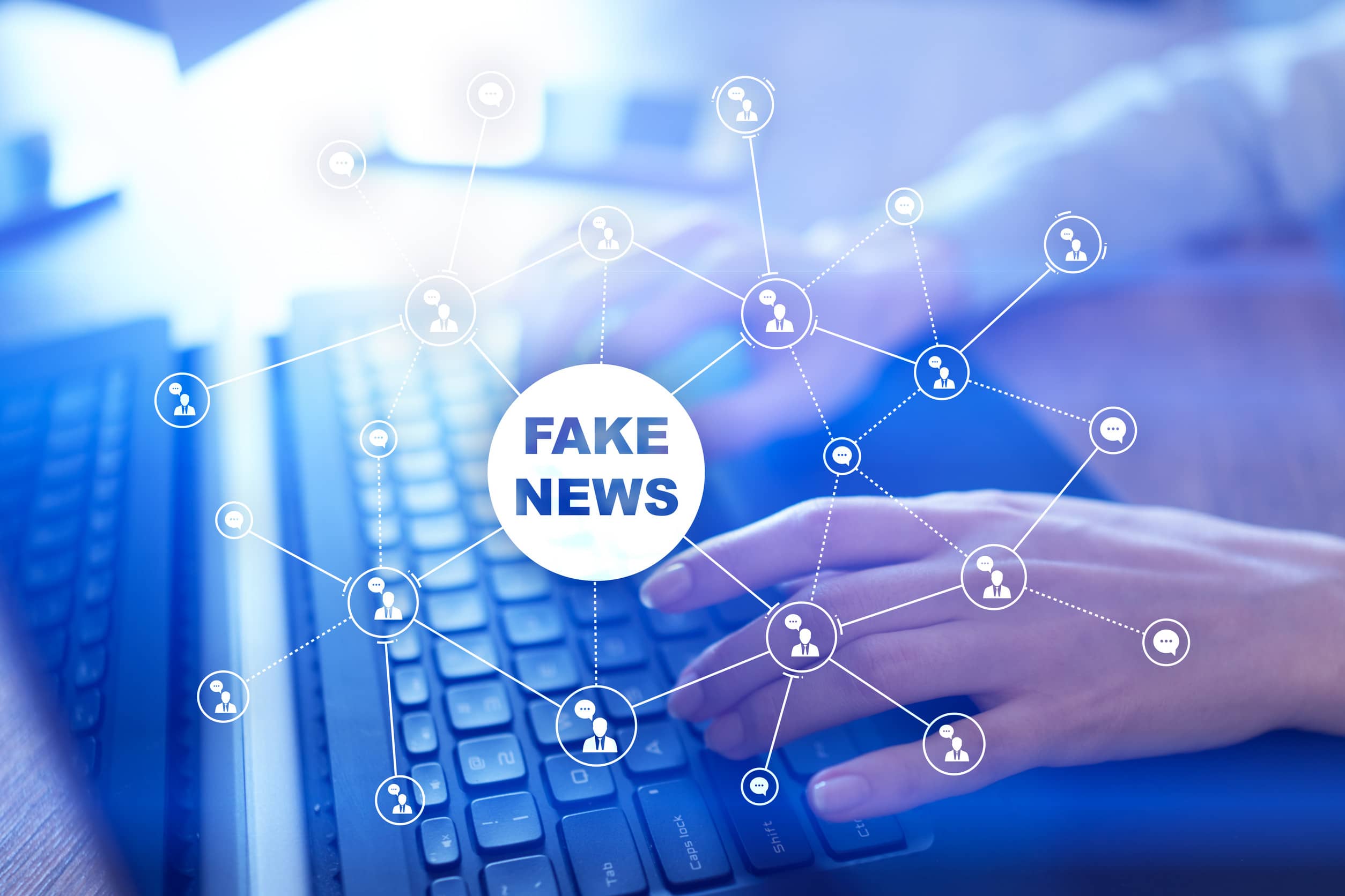 Illustration of hands on a Laptop keyboard with a web showing fake news connections